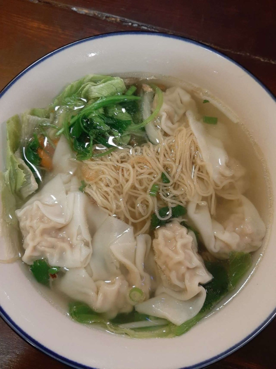 Wonton soup with noodles and vegetables.