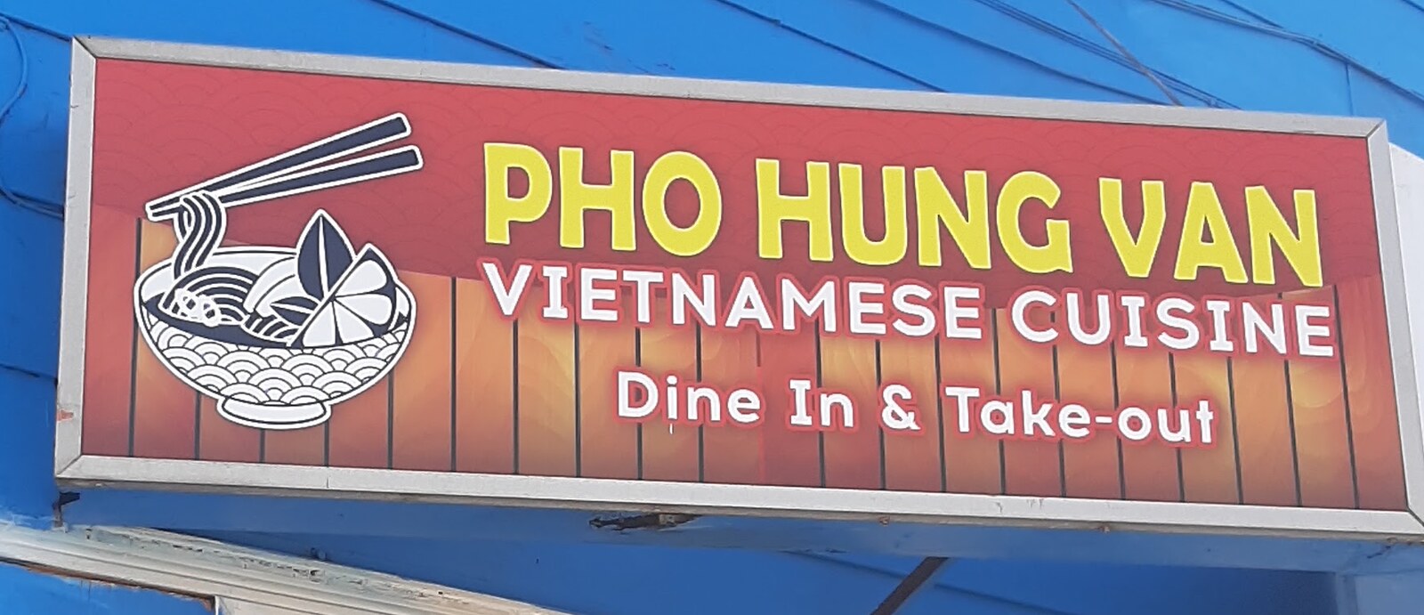 The Pho Hung Van Vietnamese Cuisine storefront sign, reading Dine In and Take-out.